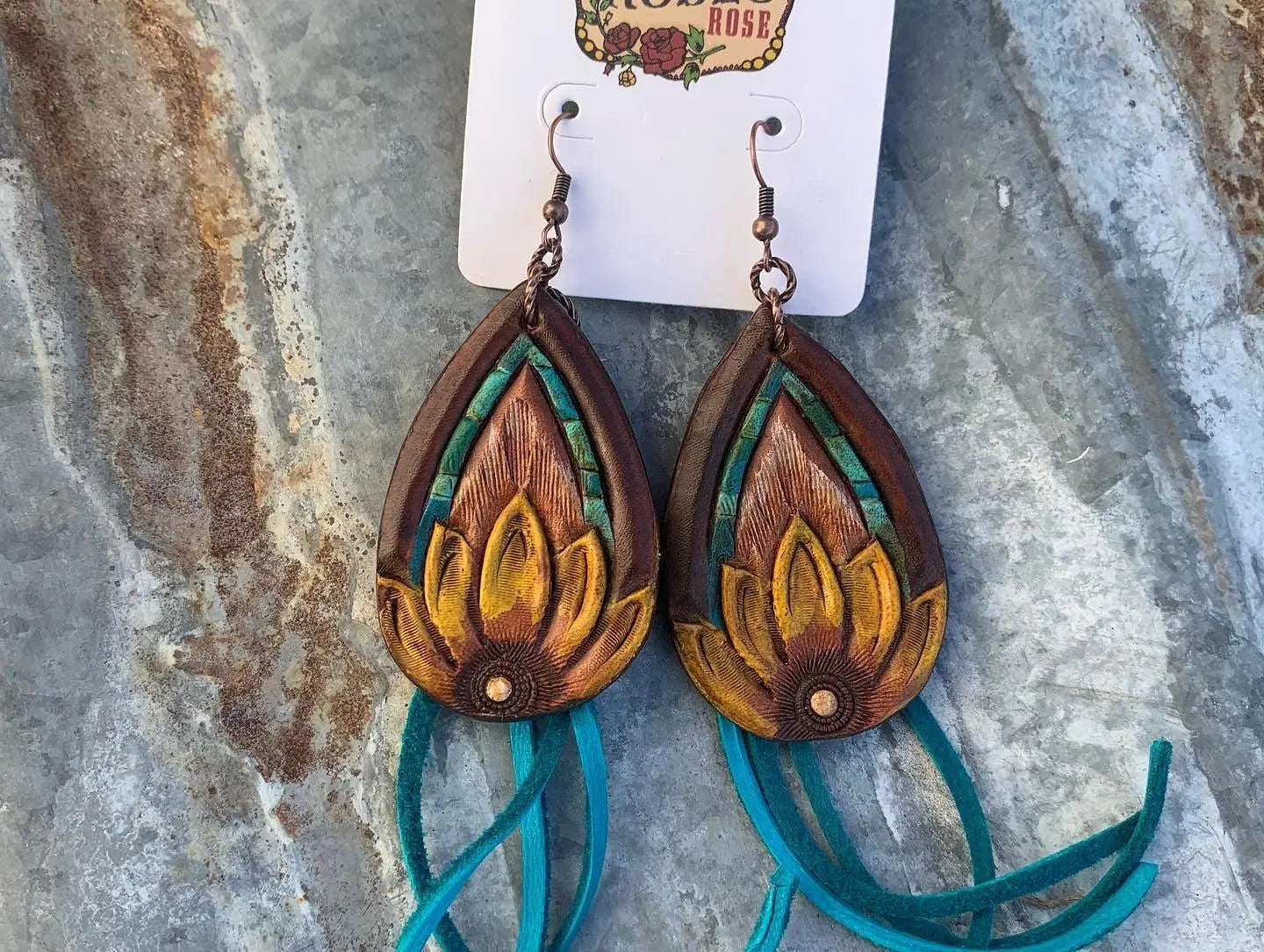 The Tad Hand Tooled Leather Earrings with Turquoise Border and Turquoise Deerskin Fringe The Rodeo Rose
